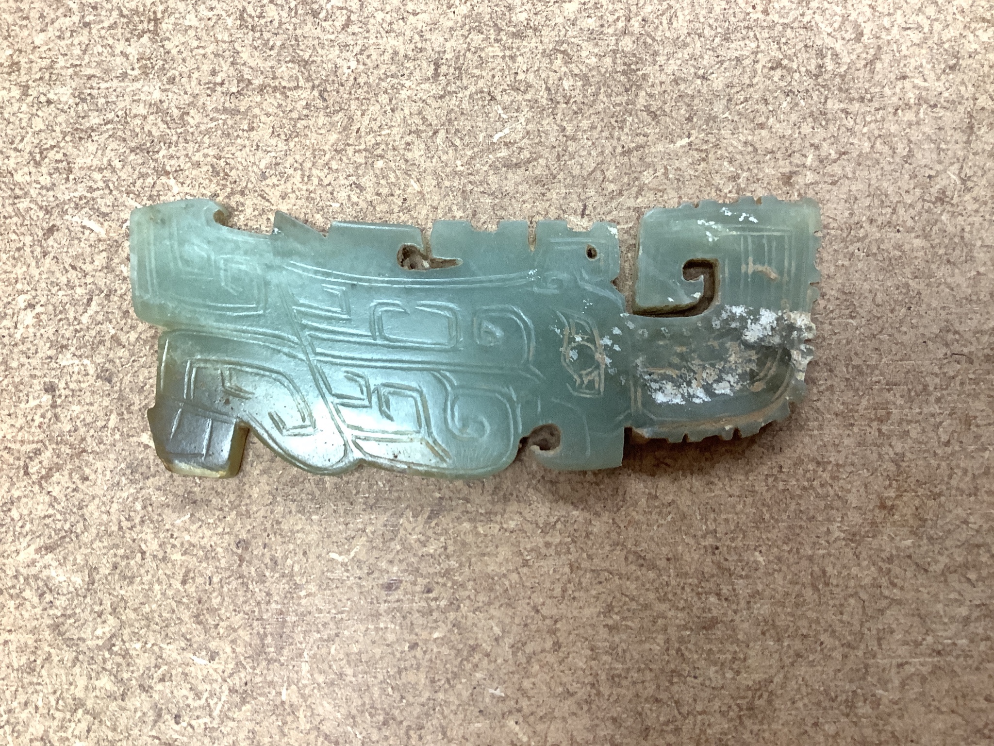 A Chinese archaistic green jade plaque, width 9cm